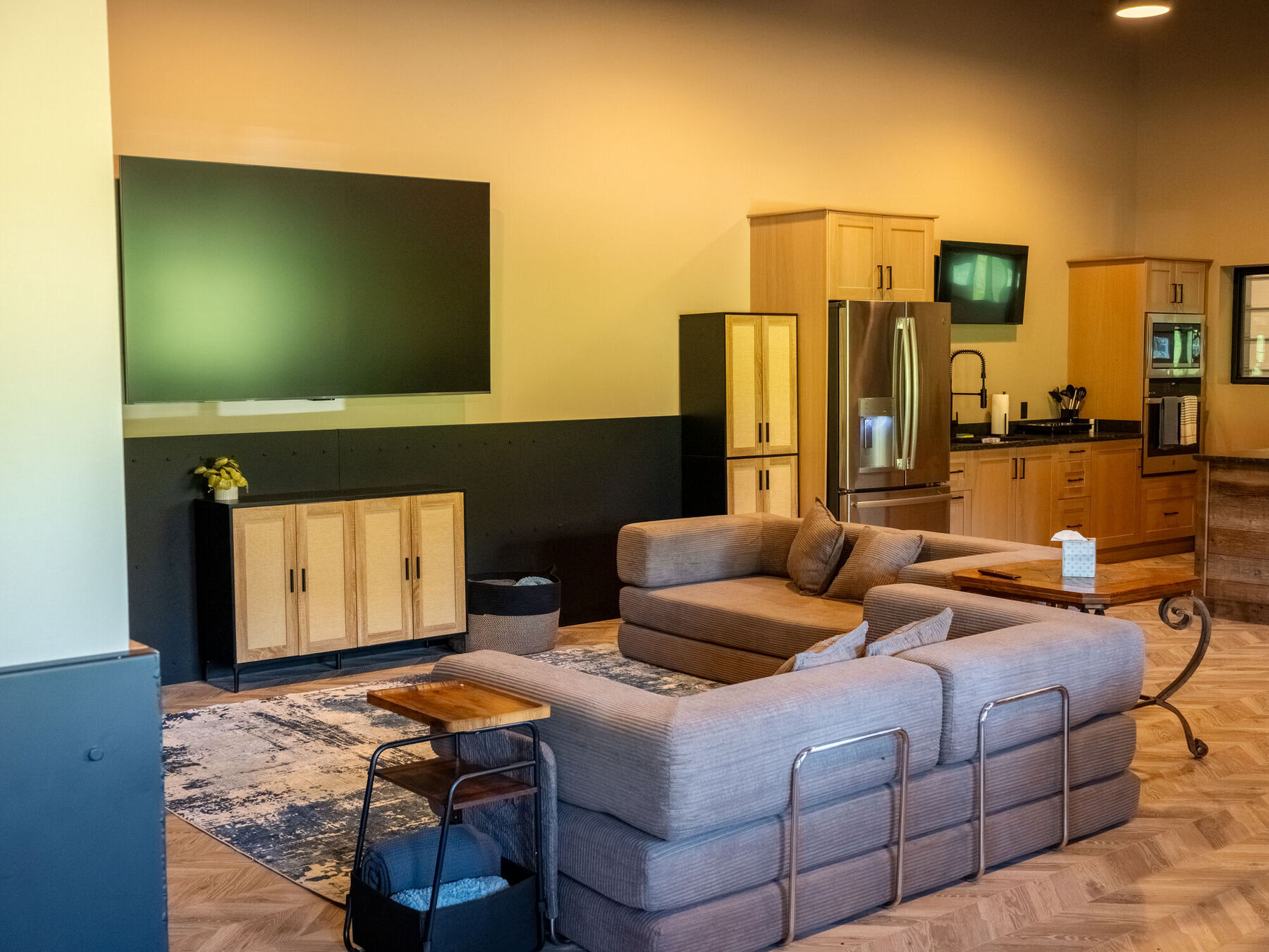 Great room with the 85-inch TV and conference system